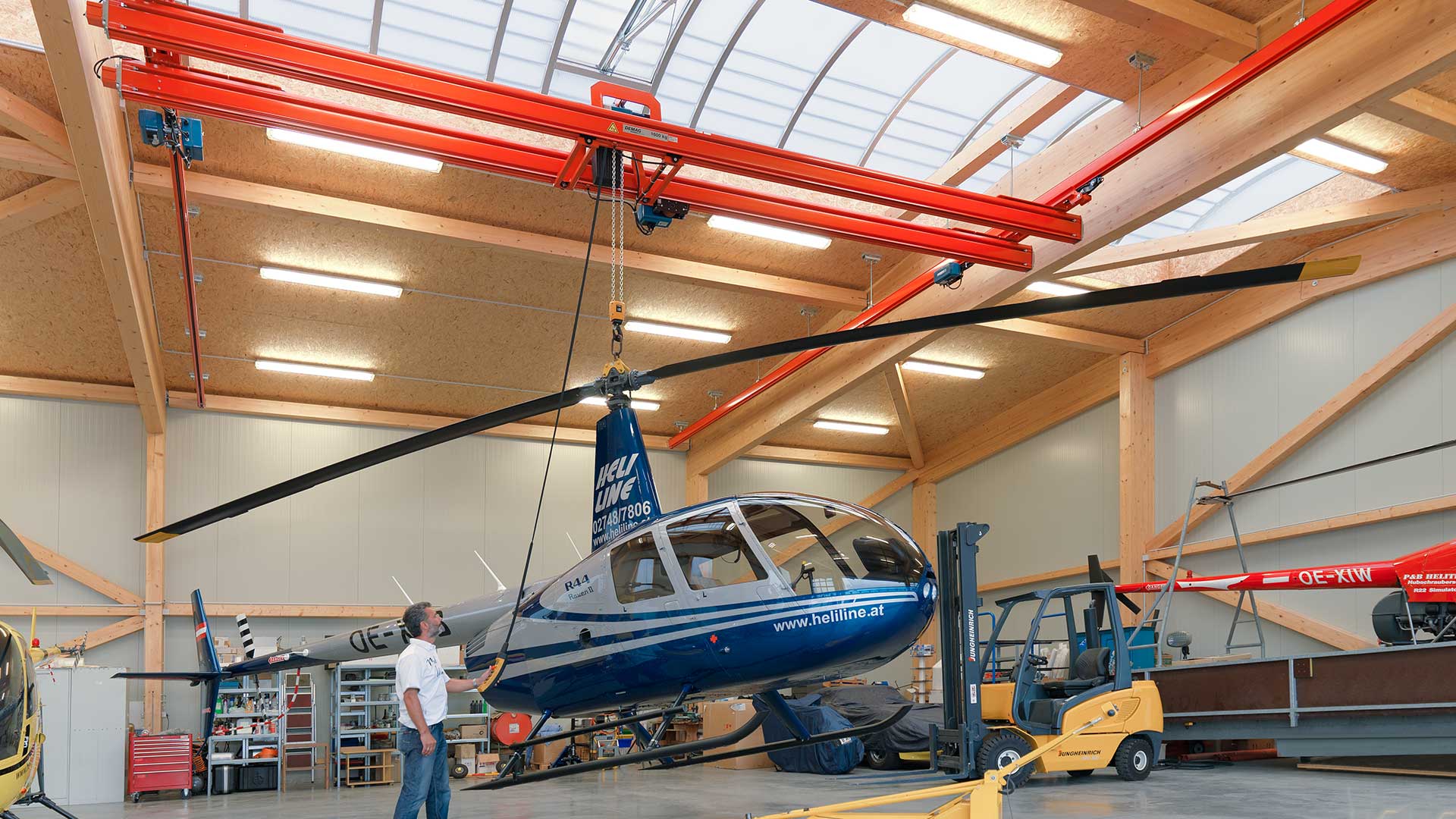 Ceiling mounted enclosed track crane system
