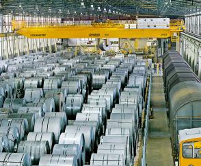   Demag process crane equipped with coil tongs for handling steel coils in the fully automated raw materials store operated by a cold-rolled strip manufacturer.