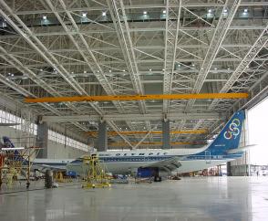 Suspension crane attached to five runway rails in a hangar