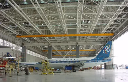 Suspension crane attached to five runway rails in a hangar