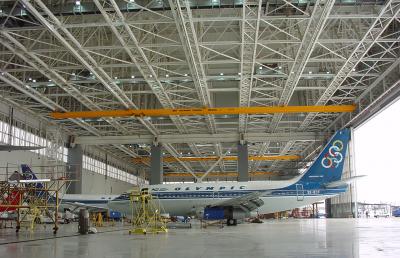 Suspension crane attached to five runway rails in a hangar