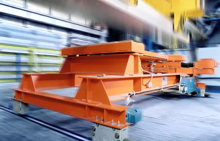 Perfect positioning: distribution carriage for aluminium bars with DRS wheel blocks and Demag offset geared motors