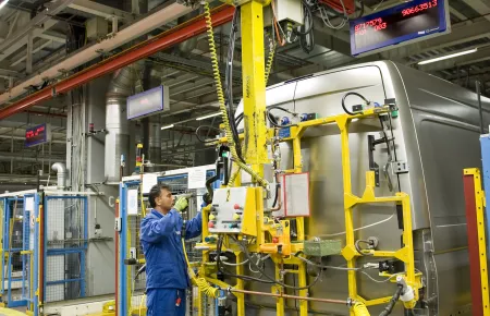 Picking up and precisely positioning rear doors with KBK cranes for manipulators in an assembly line for transport vans