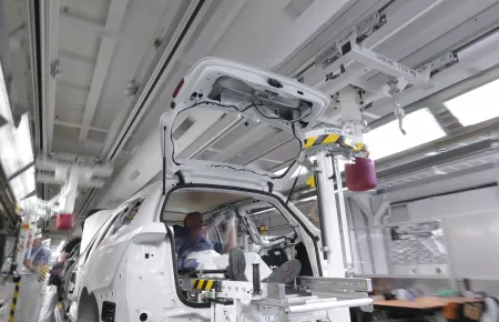 Automotive industry: safe and precise positioning of flying seats in a car final assembly line