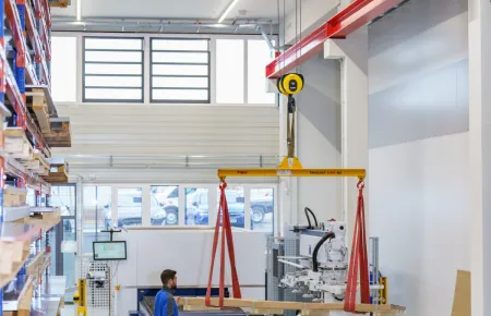 The raw material is transported to the subsequent machining centres and positioned for further processing.