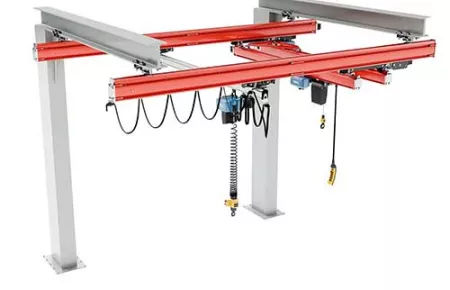 Demag patented cantilever freestanding workstation crane has one fully open side for full access for machinery, tools, and staff.