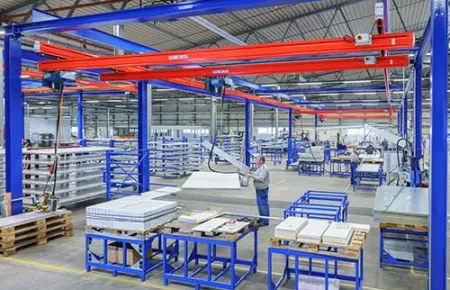 Demag Portal Freestanding Workstation Crane with steel KBK track bridges and runways and DC chain hoists.